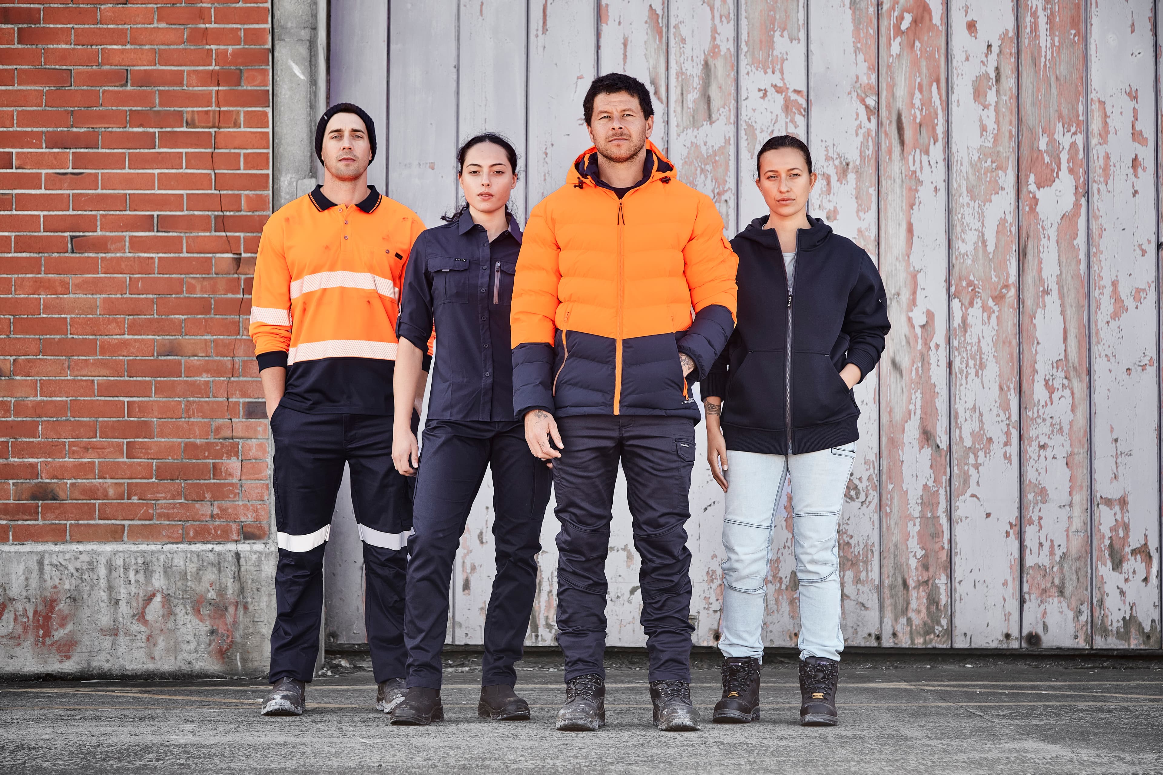 A team in branded hi-vis workwear on site